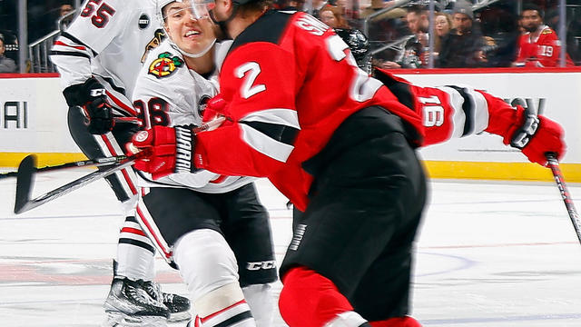 Brendan Smith #2 of the New Jersey Devils checks Connor Bedard #98 of the Chicago Blackhawks during the first period at Prudential Center on January 05, 2024 in Newark, New Jersey. 