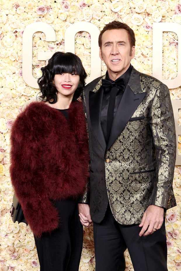 Riko Shibata and Nicolas Cage attend the 81st Annual Golden Globe Awards at The Beverly Hilton on January 07, 2024, in Beverly Hills, California.