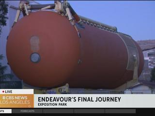 Space shuttle Endeavour fuel tank moving into position for vertical display  in Exposition Park - ABC7 Los Angeles