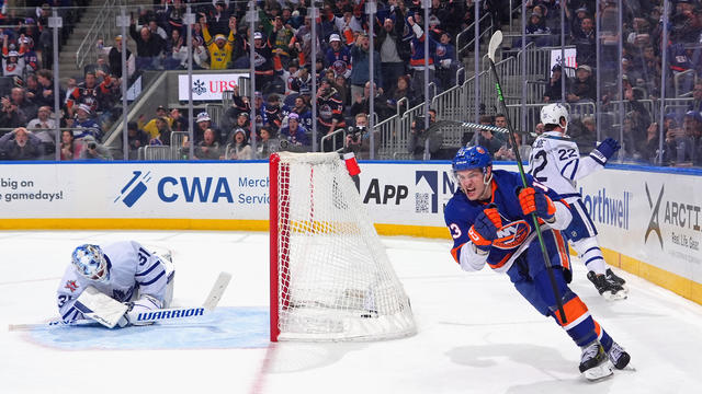 Mathew Barzal #13 of the New York Islanders scores the game-winning goal at 21 seconds of overtime against the Toronto Maple Leafs at UBS Arena on January 11, 2024 in Elmont, New York. 