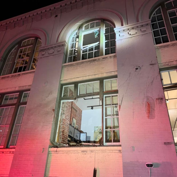 Car flies off SF exit ramp into building