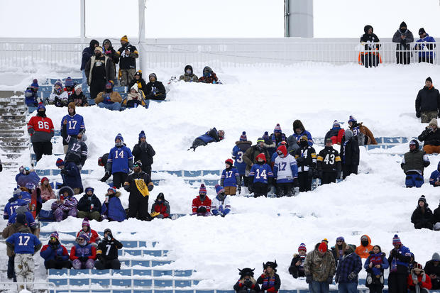 Fans take their seats in the snow before the game between the Buffalo Bills and the Pittsburgh Steelers 