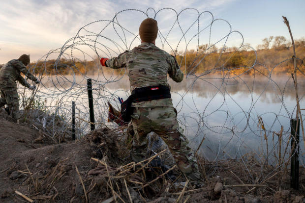 Texas National Guard soldiers install additional razor wire along the Rio Grande on Jan. 10, 2024, in Eagle Pass, Texas. 