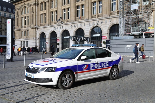 Police take security measures as people evacuate the Saint-Lazare train station due to a bomb threat in Paris, France, Nov. 6, 2023