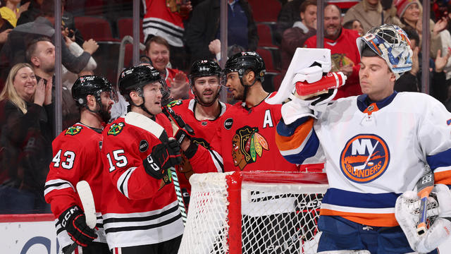 Joey Anderson #15 of the Chicago Blackhawks (middle) celebrates with Colin Blackwell #43, Jason Dickinson #16 and Seth Jones #4 after scoring against the New York Islanders in the second period at the United Center on January 19, 2024 in Chicago, Illinois 