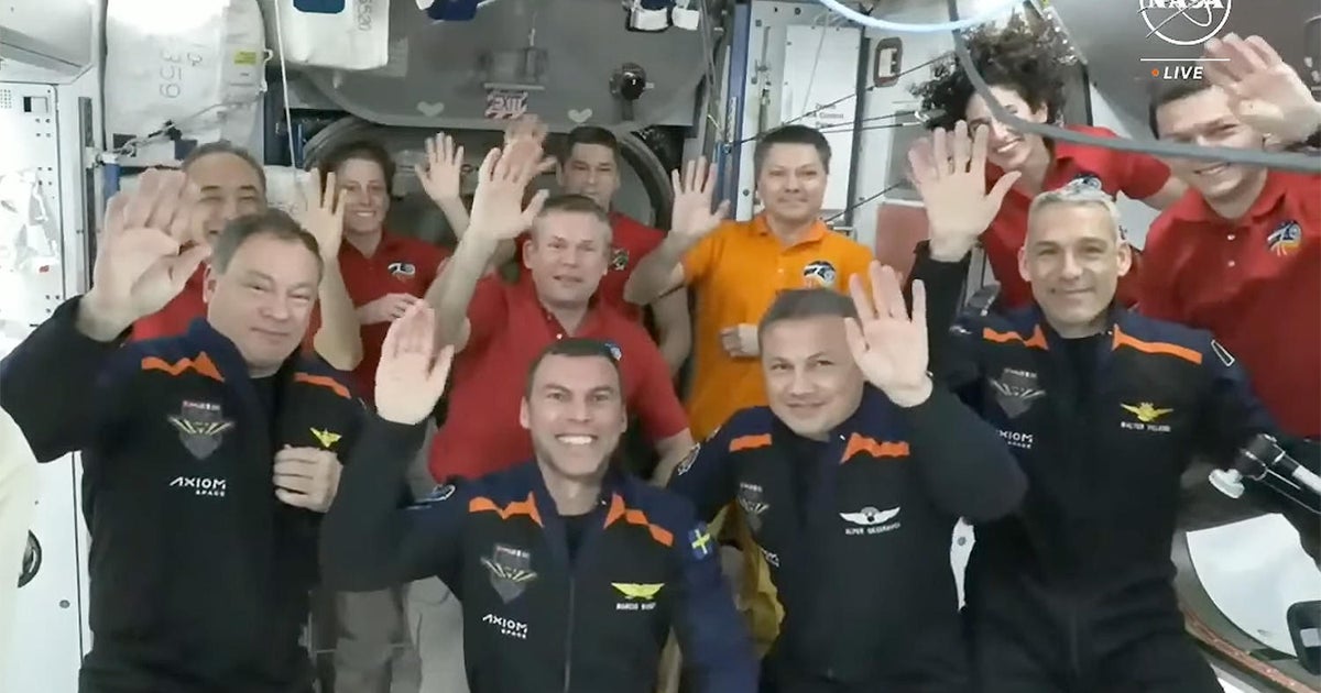 Commercial crew including first Turkish citizen in space docks with International Space Station CBS News Commercial crew including first Turkish citizen in space docks with International Space Station CBS News