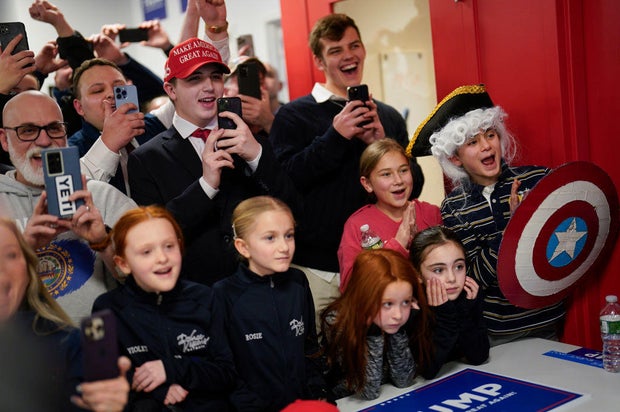 Supporters react as former president Donald Trump makes a campaign stop at the Manchester Trump campaign office in Manchester, New Hampshire, on Jan. 21, 2024.