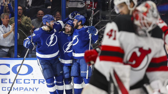 Brandon Hagel #38 of the Tampa Bay Lightning celebrates his goal with teammates Victor Hedman #77 and Nicholas Paul #20 against goalie Vitek Vanecek #41 and the New Jersey Devils during the second period at Amalie Arena on January 27 2024 in Tampa, Florid 