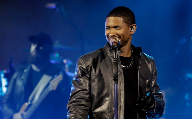 Usher performs on stage