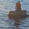 Motorists who plunged into frigid water rescued by a floating sauna