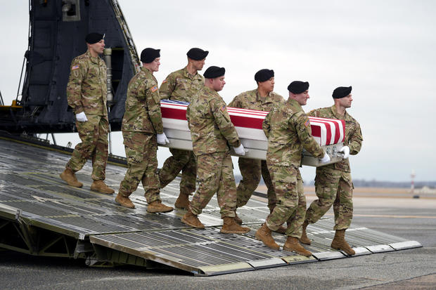 An Army carry team moves the transfer case containing the remains of U.S. Army Sgt. Breonna Alexsondria Moffett at Dover Air Force Base on Friday, Feb. 2, 2024. 