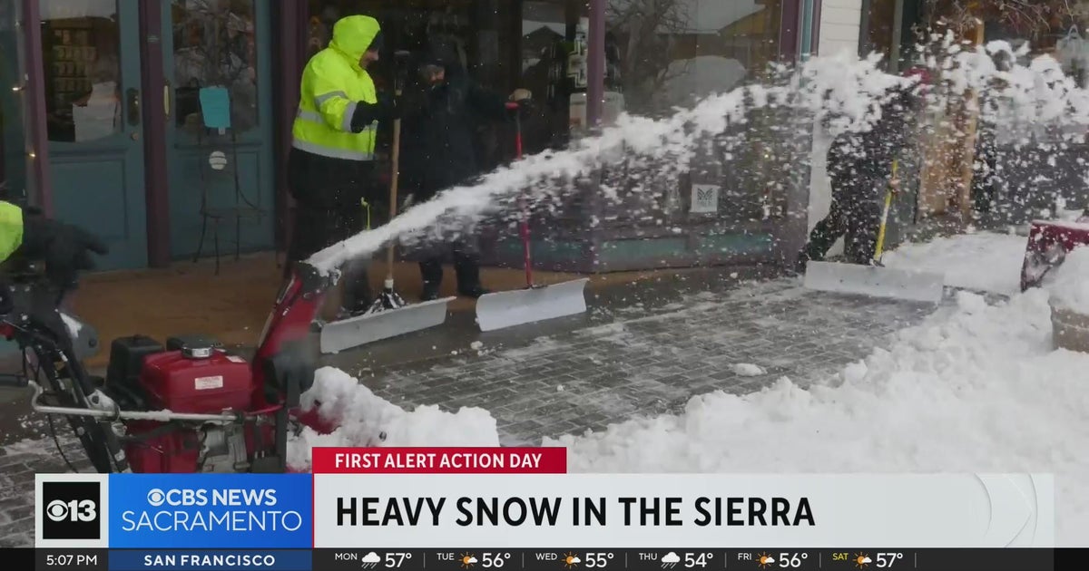 Snow plows are busy as heavy snow hits the Sierra