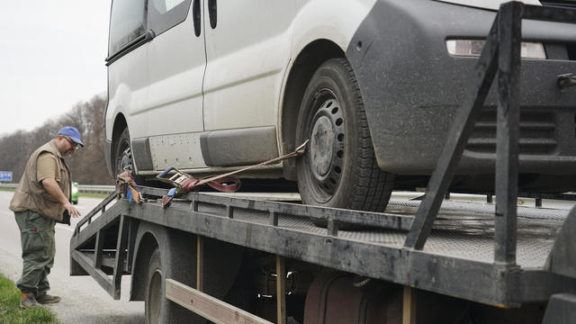 Loading a car onto a tow truck 