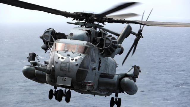 A CH-53E Super Stallion aircraft secures the area around the USS Boxer in the Arabian Sea off Oman, July 17, 2019. 