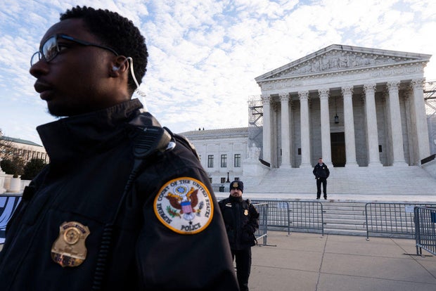 Supreme Court police officers stand outside as the court prepares to hear a case over whether former President Donald Trump is eligible to run for president in the 2024 election on Feb. 8, 2024.