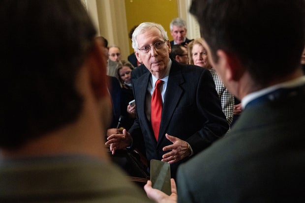 Senate Minority Leader Mitch McConnell speaks to reporters at a news conference.