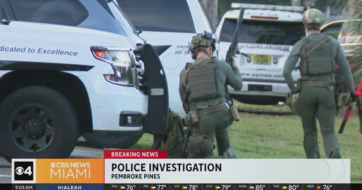 Pembroke Pines law enforcement surrounded house in Grand Palms group