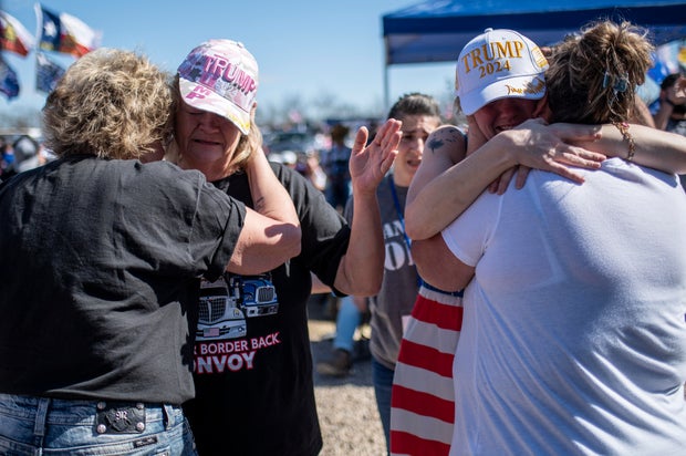 People embrace at the Take Back Our Border rally at Cornerstone Children's Ranch on Feb. 3, 2024, near Quemado, Texas.