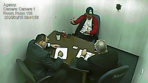 Michael Herman talks to detectives