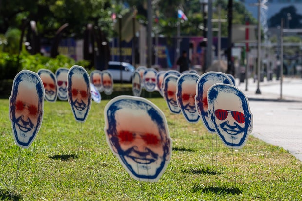 "Dark Brandon" signs are seen ahead of the third Republican Debate in Miami on November 08, 2023 in Miami, Florida.