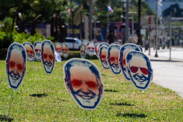 "Dark Brandon" signs are seen ahead of the third Republican Debate in Miami on November 08, 2023 in Miami, Florida. 