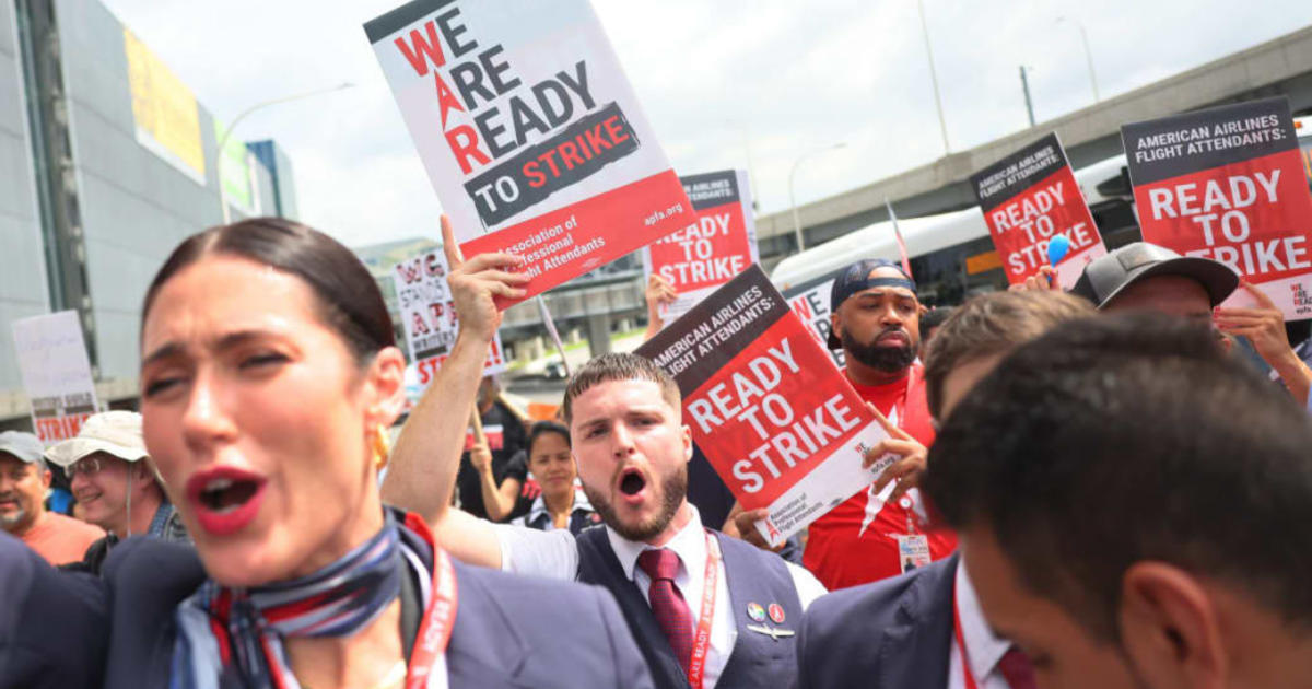 Flight attendants hold picket signs and rallies in protest for new contracts, pay raises