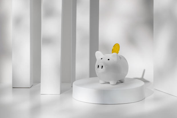 Money saving concept -Piggy bank and gold coin 