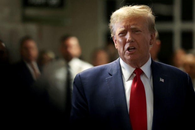 Former President Donald Trump departs a pretrial hearing in his "hush money" case at Manhattan Criminal Court on Feb. 15, 2024.