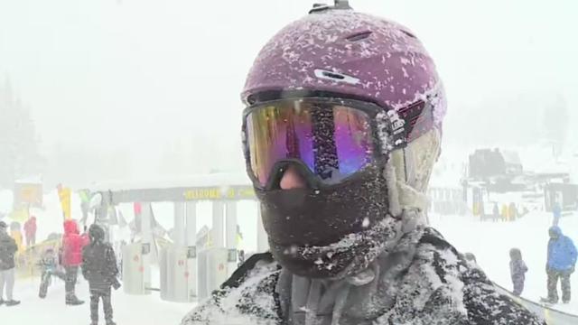 snowboarder covered in snow closeup boreal 