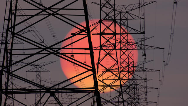 Electric transmission lines at sunrise. 