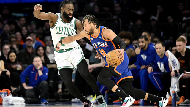Jalen Brunson #11 of the New York Knicks is defended by Jaylen Brown #7 of the Boston Celtics during the first half at Madison Square Garden on February 24, 2024 in New York City. 