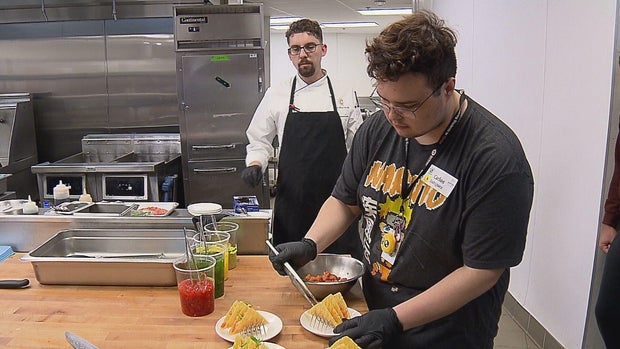 An APS student participates in work based learning related to culinary arts