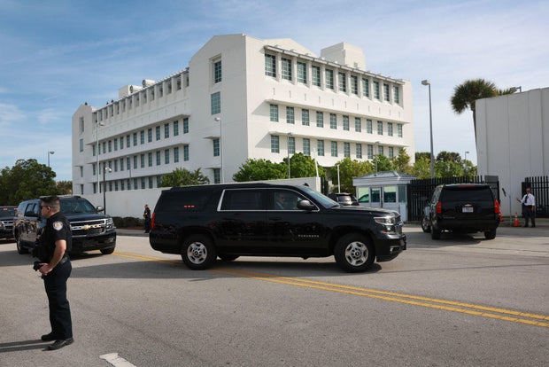 A vehicle carrying former President Donald Trump is driven to the Alto Lee Adams Sr. U.S. Courthouse on March 1, 2024, in Fort Pierce, Florida.