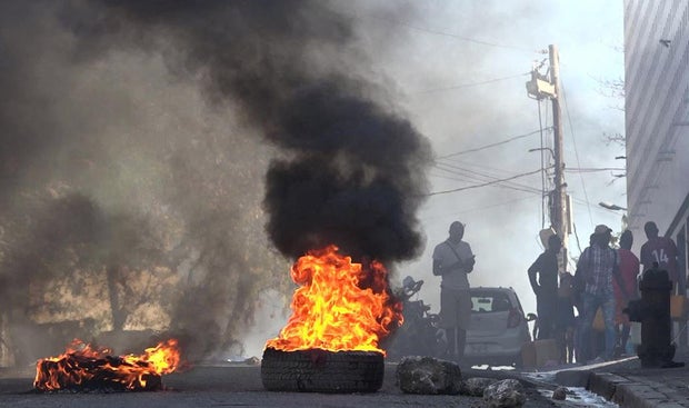 Fire burns outside a prison in Haiti following a gang attack 