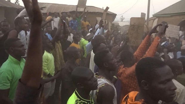 A screengrab taken from video shows families of abducted pupils gathering during the visit of Kaduna state Gov. Uba Sani on March 7, 2024, after gunmen kidnapped more than 280 pupils from a school in Kuriga, Kaduna, northern Nigeria.