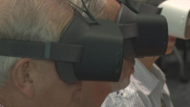 Seniors wearing virtual reality headsets 