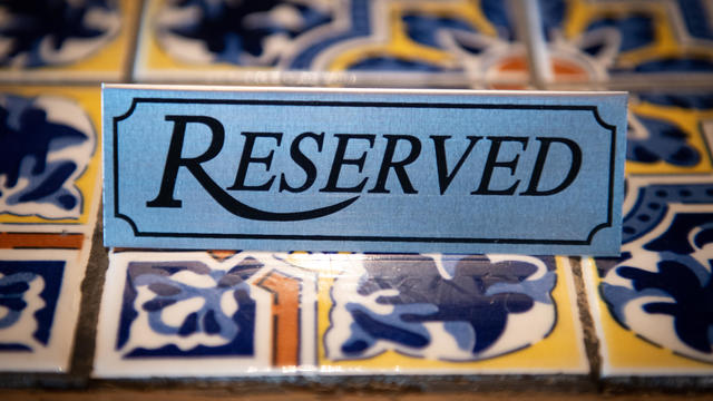 Close-up of a reserved Sign on Tiled Table 