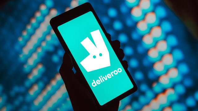 In this photo illustration, the Deliveroo logo is displayed 
