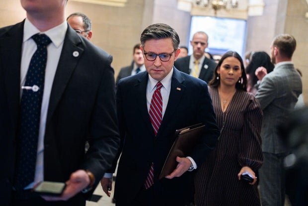 Speaker of the House Mike Johnson makes his way to the House floor on Friday, March 22, 2024.