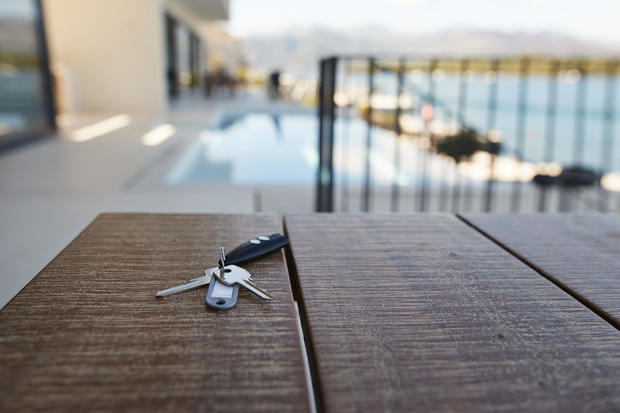 House keys against swimming pool 