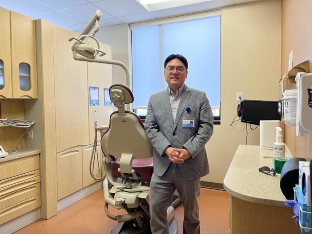 Sung Cho, a dentist, in a treatment room at a health center 