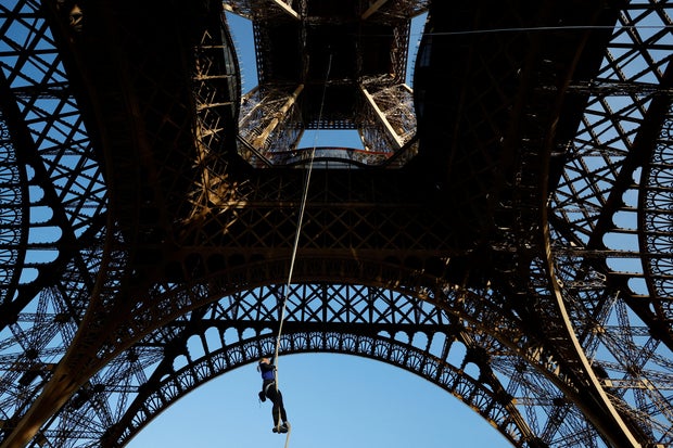 Athlete Anouk Garnier attempts the world record for rope climbing on the Eiffel Tower in Paris