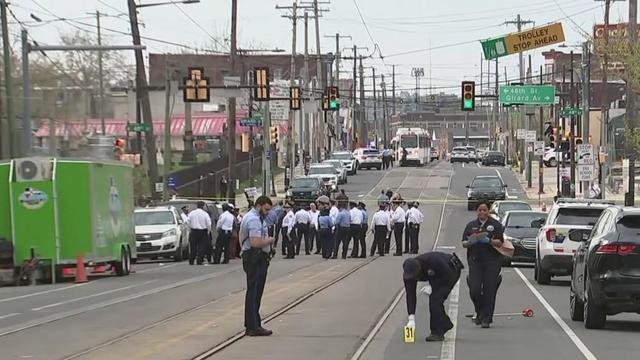Several police officers are on scene at an intersection in Philadelphia 
