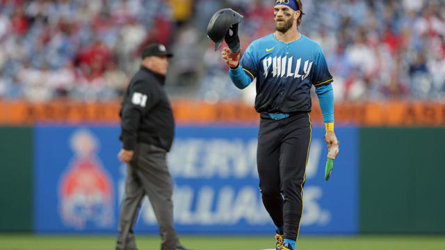 Bryce Harper tosses his helmet, wearing the Philadelphia City Connect jersey, on April 12. 