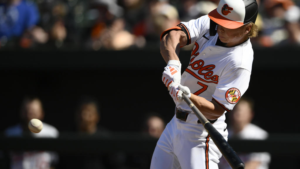 Much-needed Holliday: Orioles rookie comes through with first big
league hit
