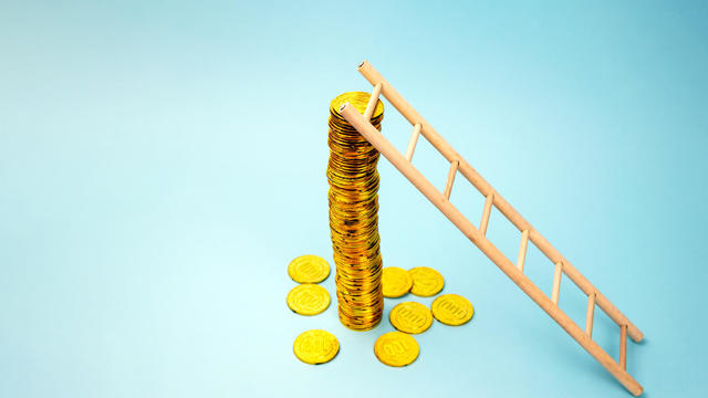 Ladder and Stack Of Coins 