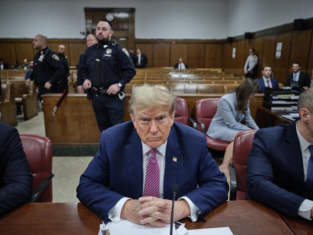 Former President Donald Trump sits in Manhattan Criminal Court