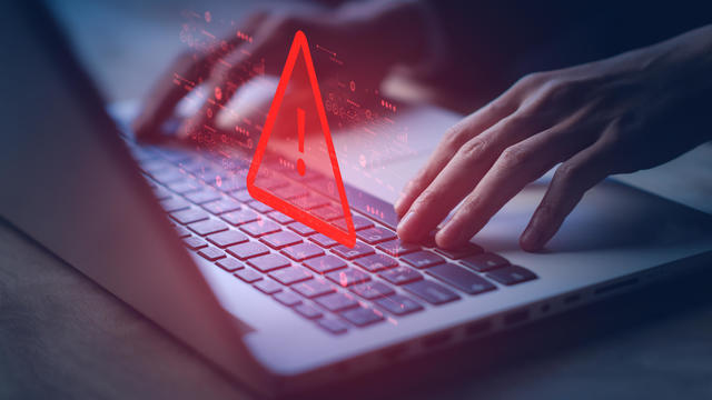 System hacked warning alert on notebook (Laptop). Cyber attack on computer network, Virus, Spyware, Malware or Malicious software. Cyber security and cybercrime. Compromised information internet. 