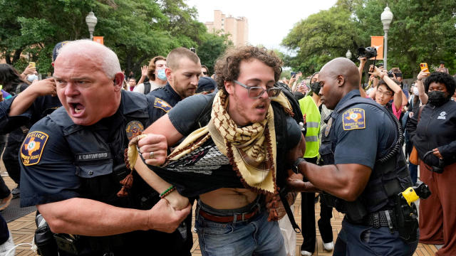 University of Texas police detain a man at a protest over Israel's war in Gaza at the University of Texas in Austin, Texas, April 24, 2024. 
