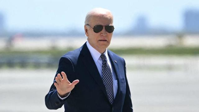 President Biden waves as he walks to board Air Force One at John F. Kennedy International Airport in New York on April 26, 2024. 